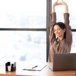 Good,Morning.,Happy,Female,Manager,Stretching,Her,Body,And,Arms