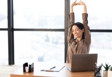 Good,Morning.,Happy,Female,Manager,Stretching,Her,Body,And,Arms