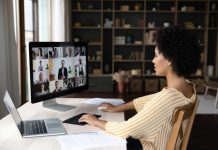 Side,View,Concentrated,Millennial,African,American,Business,Woman,Holding,Video