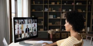 Side,View,Concentrated,Millennial,African,American,Business,Woman,Holding,Video