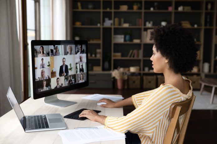 Side,View,Concentrated,Millennial,African,American,Business,Woman,Holding,Video