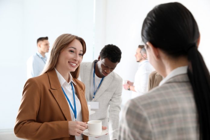Group,Of,People,Chatting,During,Coffee,Break,Indoors