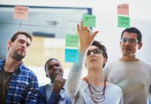 Team,,Female,Speaker,And,Sticky,Notes,On,Glass,For,Timeline,