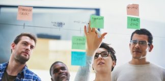 Team,,Female,Speaker,And,Sticky,Notes,On,Glass,For,Timeline,