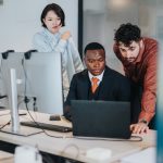 Team,Of,Coworkers,In,A,Contemporary,Office,Working,Together,On