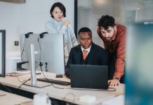 The AI Readiness Gap Inside Your Company Team,Of,Coworkers,In,A,Contemporary,Office,Working,Together,On