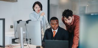 Team,Of,Coworkers,In,A,Contemporary,Office,Working,Together,On