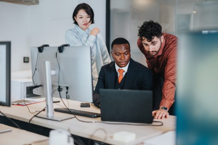 Team,Of,Coworkers,In,A,Contemporary,Office,Working,Together,On Team,Of,Coworkers,In,A,Contemporary,Office,Working,Together,On