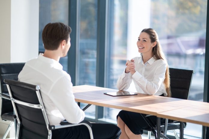 Hr,Manager,Having,An,Interview,With,A,Male,Candidate,In