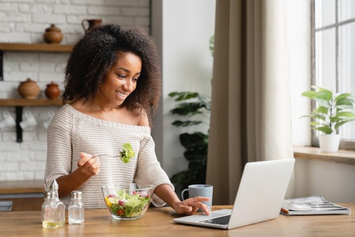 Smiling,African,Young,Woman,Girl,Eating,Vegan,Vegetarian,Salad,At Explore how the lunch and learn model impacts employee well-being and professional development in today's work environment.