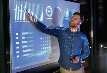 The Key to Closing Construction Workforce Gaps Statistics,On,The,Screen.,Business,Coach,Against,Projector,With,Data.