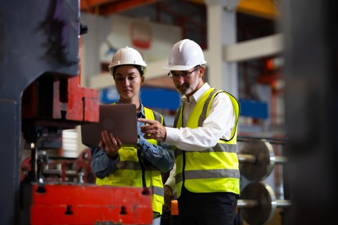 Senior,Manager,Man,Factory,Worker,Training,To,Woman,Colleague,On